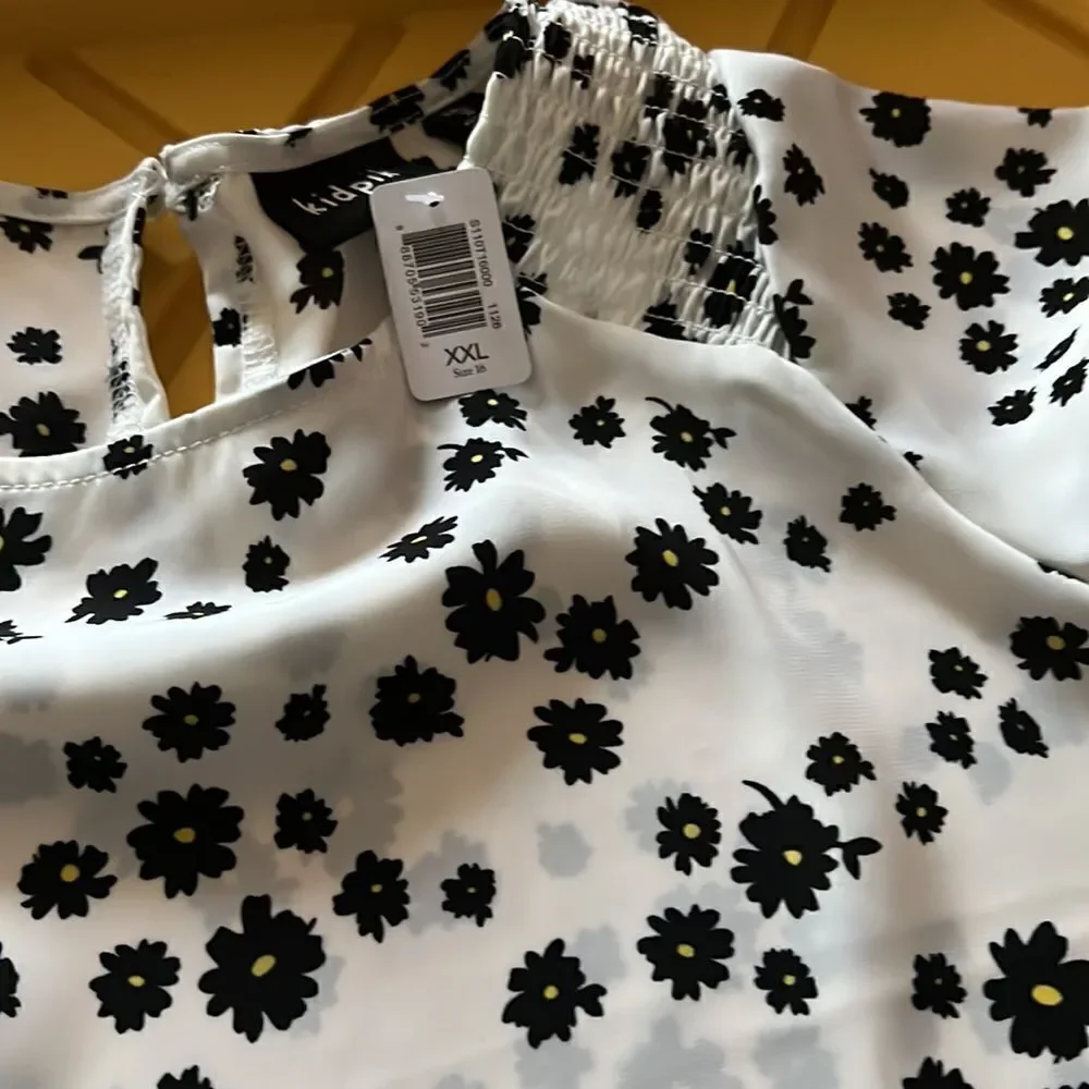 Kidpik shirt sleeve blouse with single button closure at back